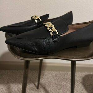 Black pointed toe loafers with gold accent
Size 8.5